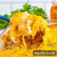 Close up looking at a large scoop of King Ranch Chicken Casserole.