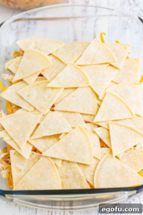 Cut tortillas on top of other layers of the King Ranch Casserole.