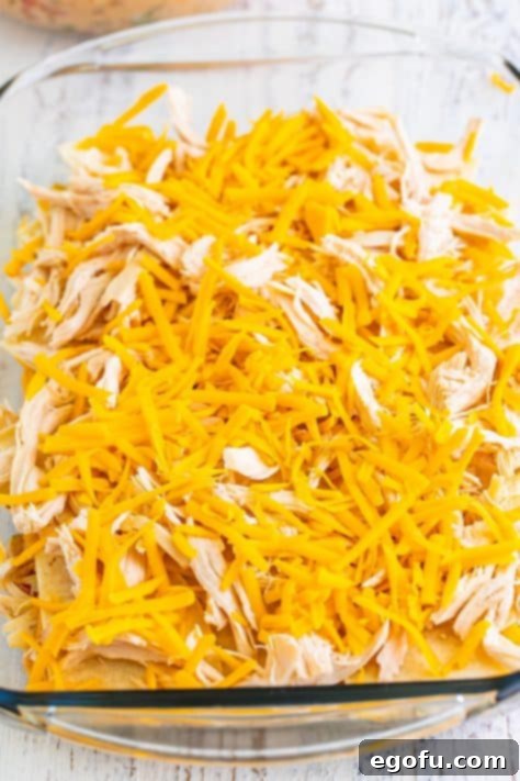 Layers of King Ranch Chicken Casserole in a baking dish.