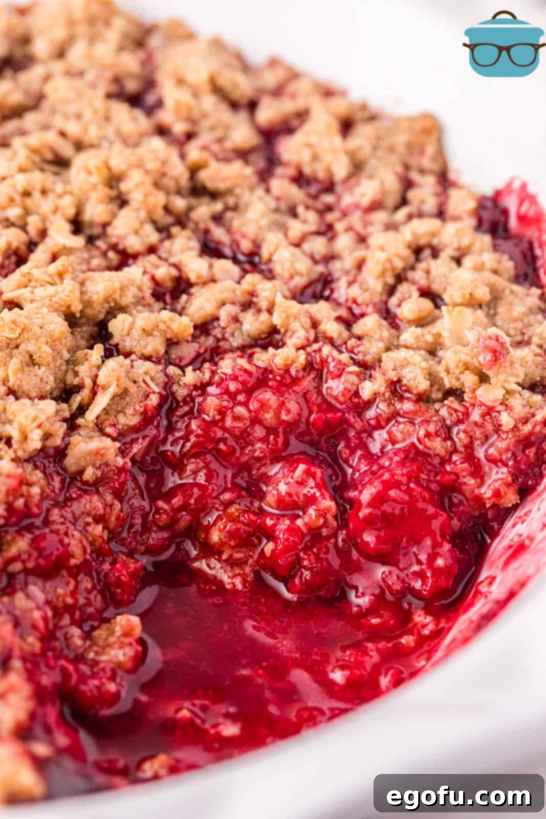Looking down on a Raspberry Crumble with a scoop removed.