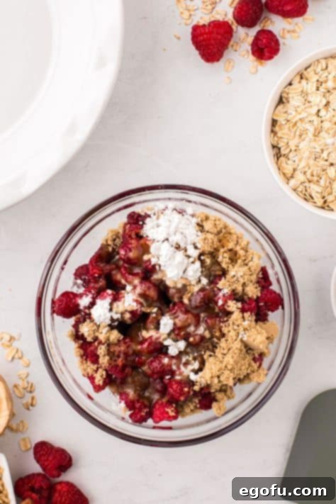 raspberries, brown sugar and cornstarch in a bowl.