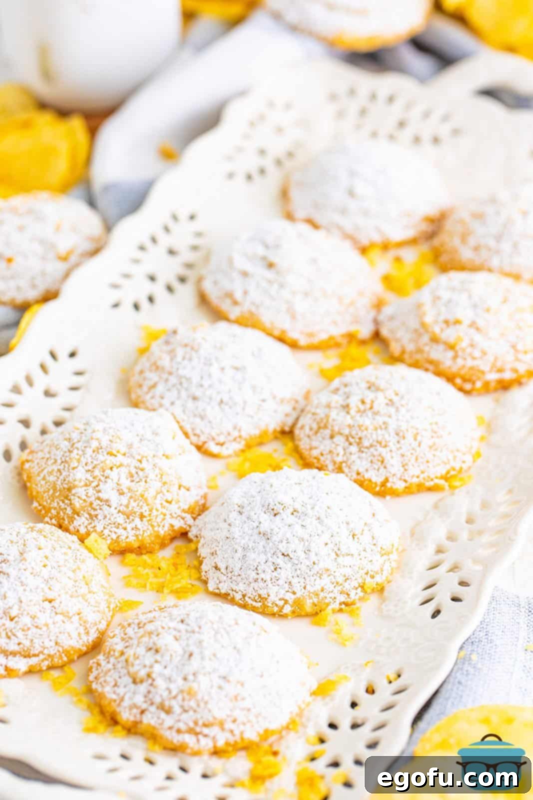A white serving plate with a few Potato Chip Cookies on it.