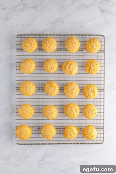 Fresh baked Potato Chip Cookies on a wire rack.