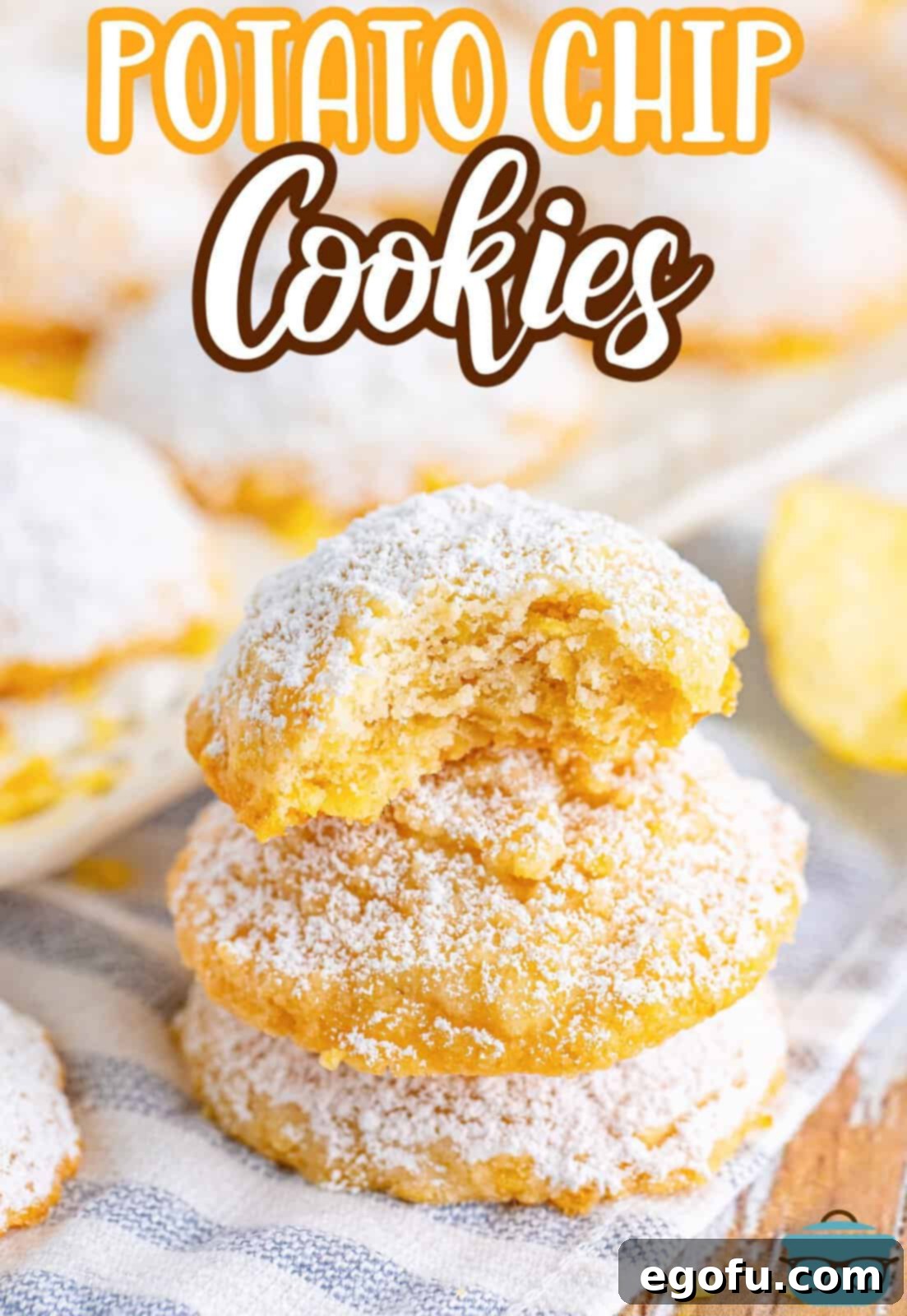 A pile of Potato Chip Cookies, with one on top that has a bite missing.