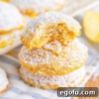 Close up looking at a stack of Potato Chip Cookies, with the top one bit in half.