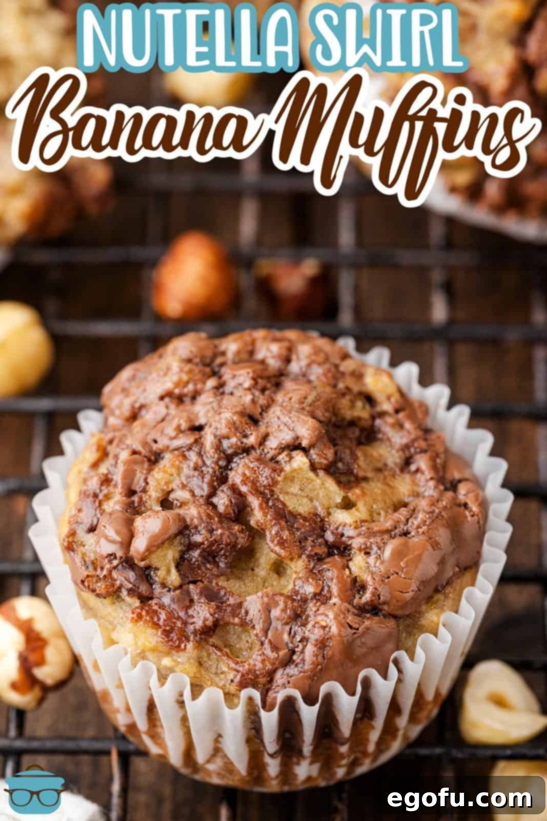 A single, perfectly baked Nutella Swirl Banana Muffin, nestled in its wrapper, inviting a delicious bite.