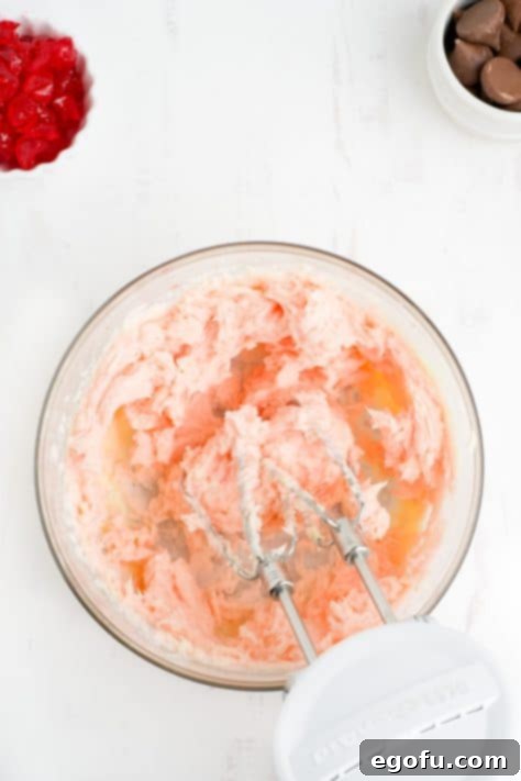 Sakura Bloom Bites 11 Butter, sugar, cherry juice and extract in a mixing bowl.
