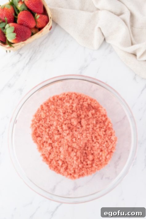 Decadent Strawberry Cake Bites 16 Strawberry cake crumbles in a bowl.