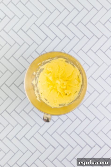 Festive Confetti Cupcakes 18 Creamed butter in a stand mixing bowl, perfectly whipped and ready for sugar.