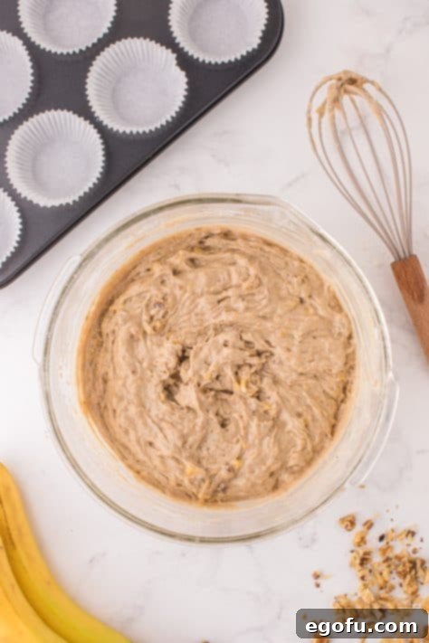 Banana Nut Cake Mix Muffin batter in a glass bowl.