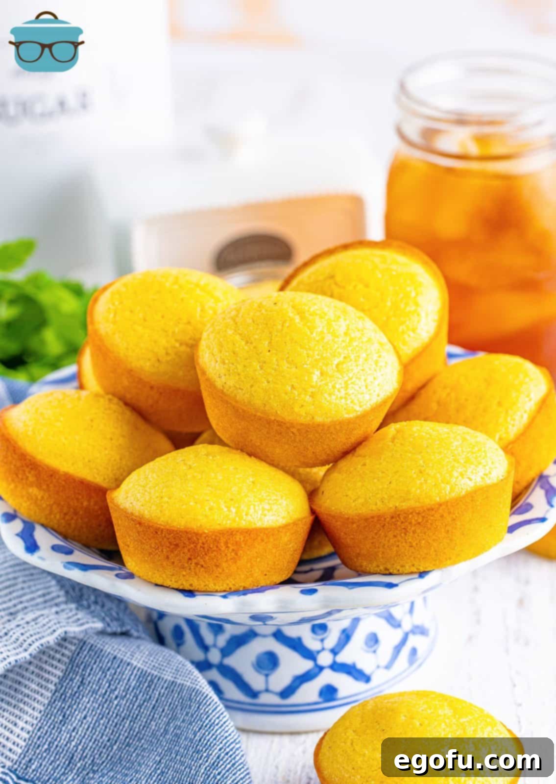 Golden Corn Muffins 2 A serving plate of homemade Cornbread Muffins, golden and inviting.