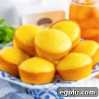 Golden Corn Muffins 8 Close up looking at a plate of Cornbread Muffins.