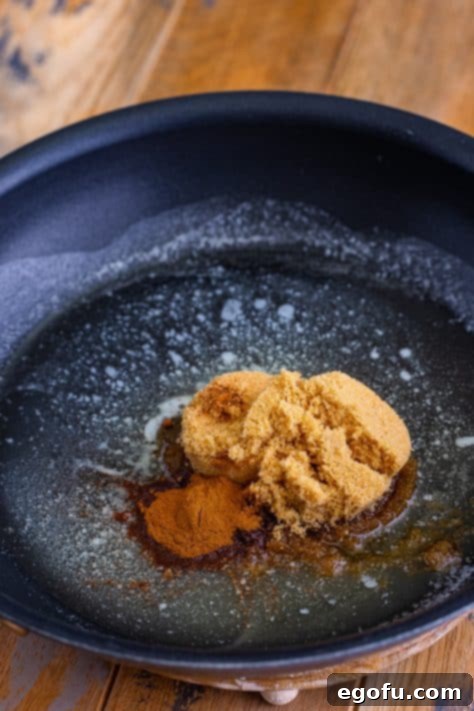 butter, brown sugar, cinnamon and nutmeg in a skillet.