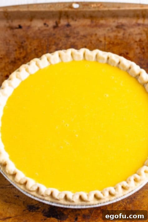 An uncooked Buttermilk Pie.