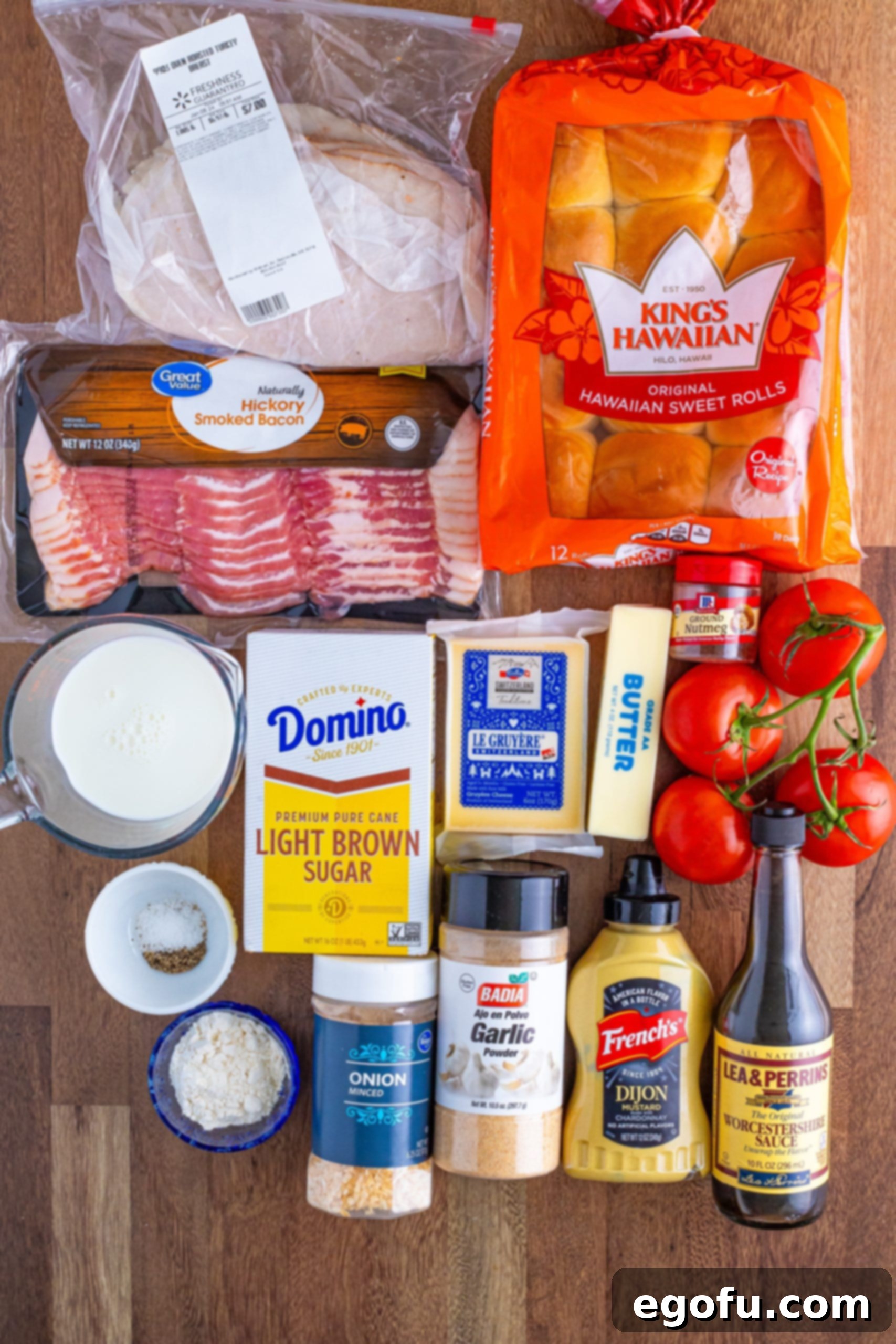 Bacon, light brown sugar, Hawaiian rolls, Worcestershire sauce, tomatoes, butter, flour, salt, black pepper, nutmeg, whole milk, shredded gruyere cheese, deli turkey, dijon mustard, dried onion flakes, and garlic powder.