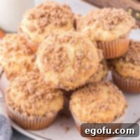 A plate with a pile of Cinnamon Streusel Cake Mix Muffins, invitingly arranged.