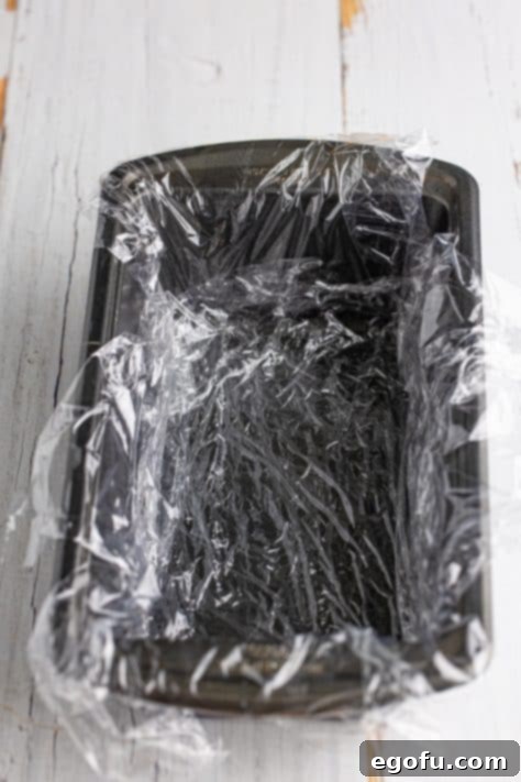 A plastic wrap lined loaf pan.