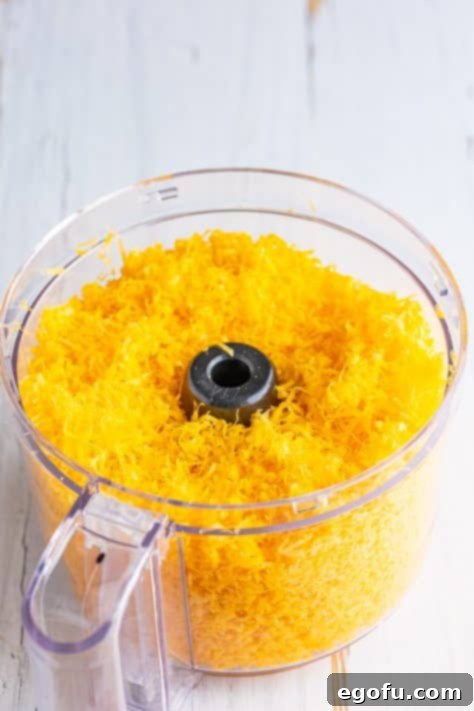 Fresh shredded cheese in a food processor.