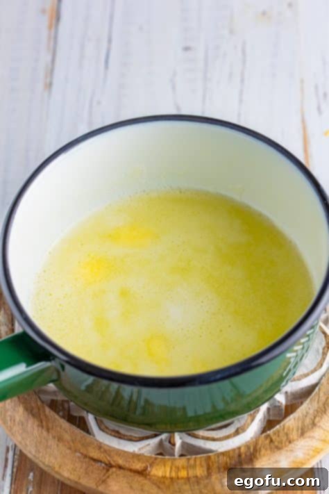 Water and butter simmering in a saucepan.