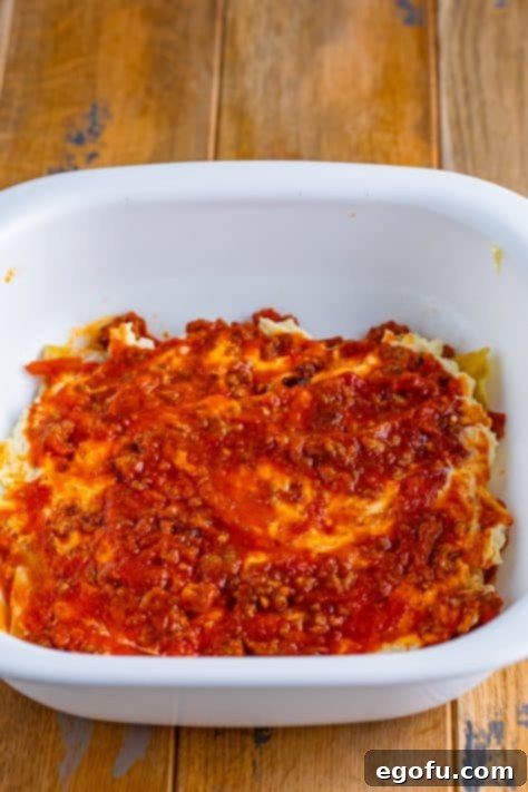 Cozy Lasagna Dinner for Two 20 More marinara on top of cheese and noodles.