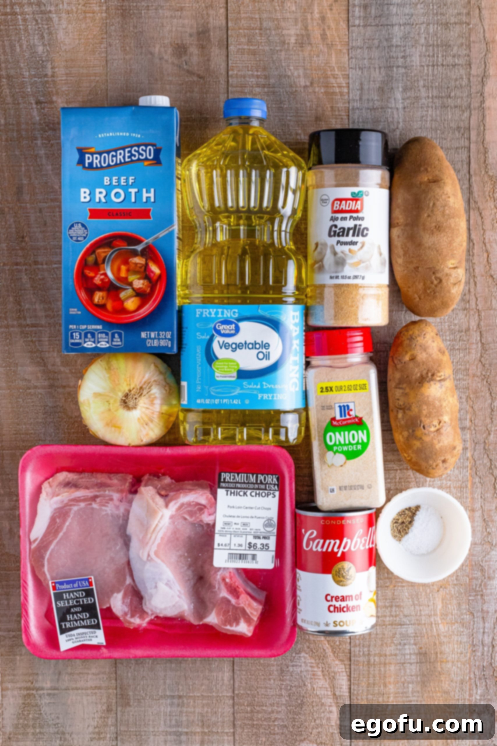 Easy One-Pot Pork Chops and Potatoes for Two 4 Pork Chops, vegetable oil, garlic powder, onion powder, salt, pepper, potatoes, onion, cream of chicken soup, and beef broth.