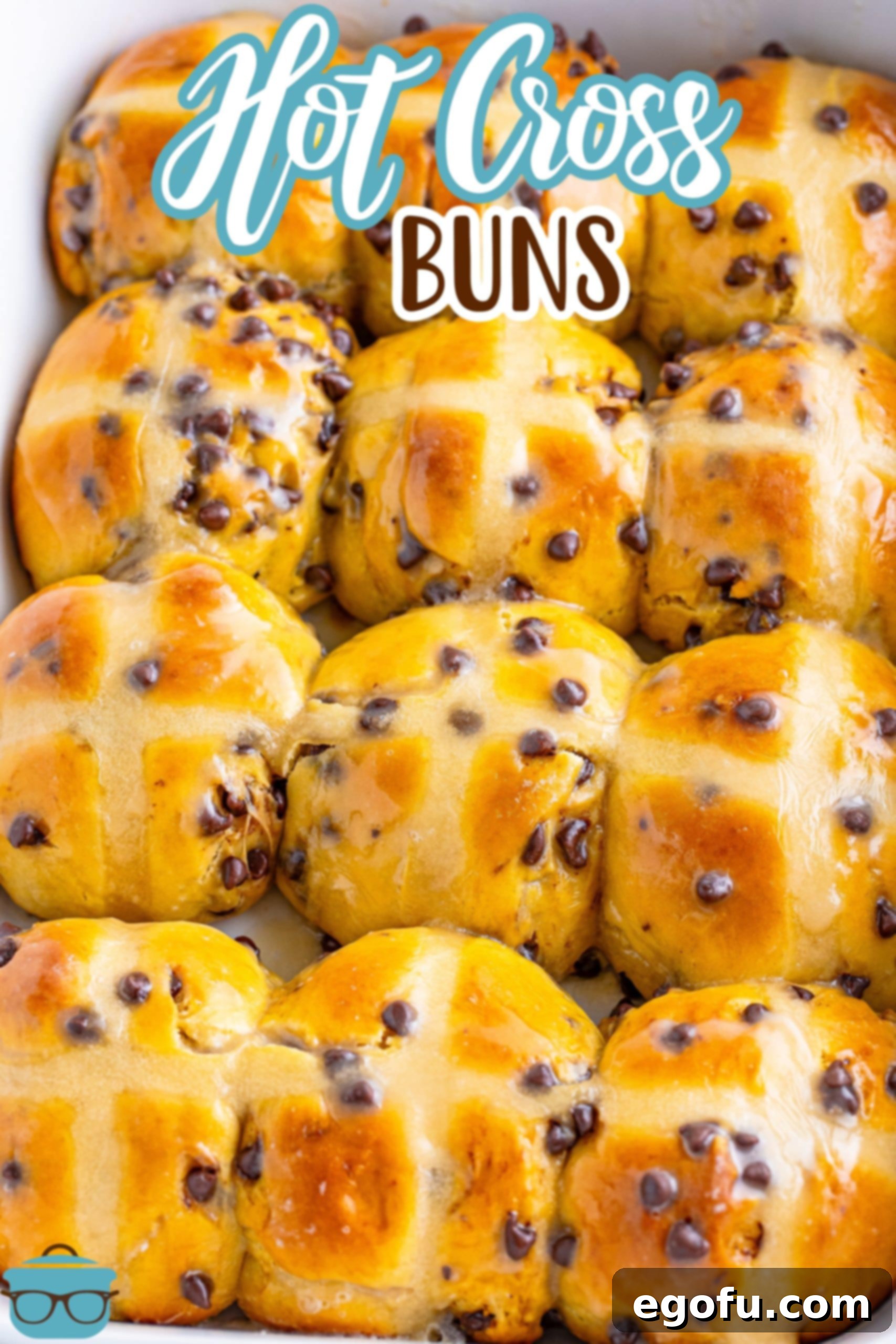 Indulgent Chocolate Hot Cross Buns 3 A batch of Hot Cross Buns in a baking dish, perfectly golden brown and ready to be glazed.