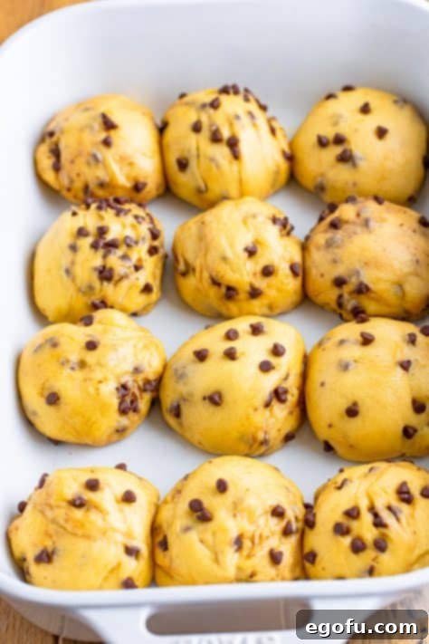 Indulgent Chocolate Hot Cross Buns 24 Hot cross bun dough balls that have risen.