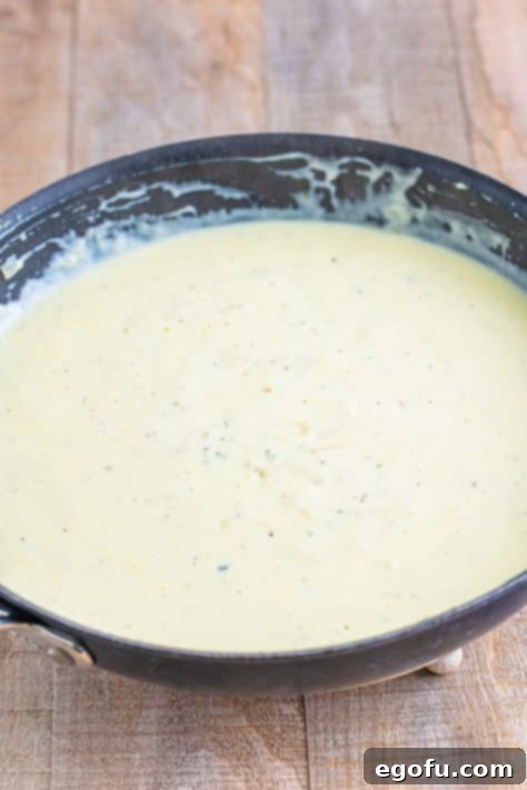 A thick cream sauce in a skillet.