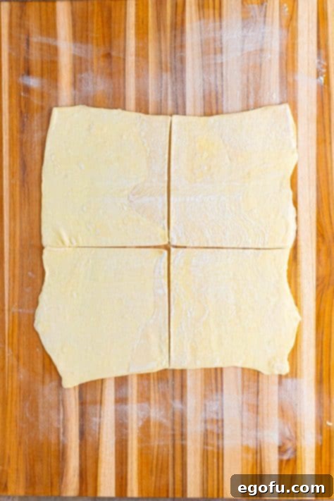 Puff pastry rolled out and cut in to 4 sections.