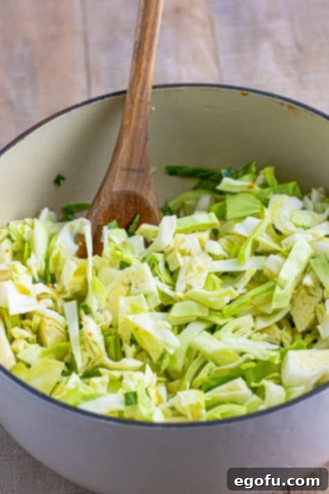 Sliced cabbage in a dutch oven.