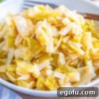 a white plate topped with homemade sauerkraut.