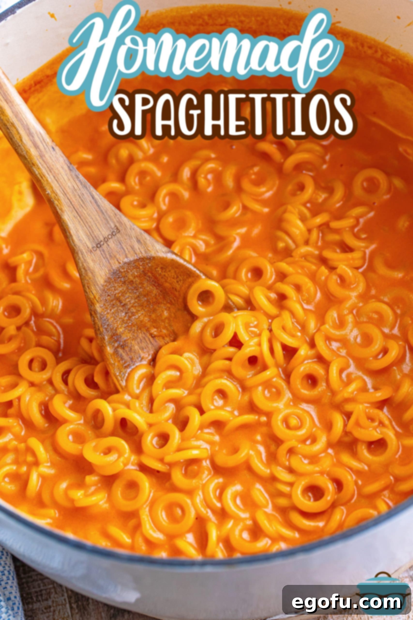 Wholesome Pasta O's 5 A wooden spoon in a pot of Homemade Spaghettios.