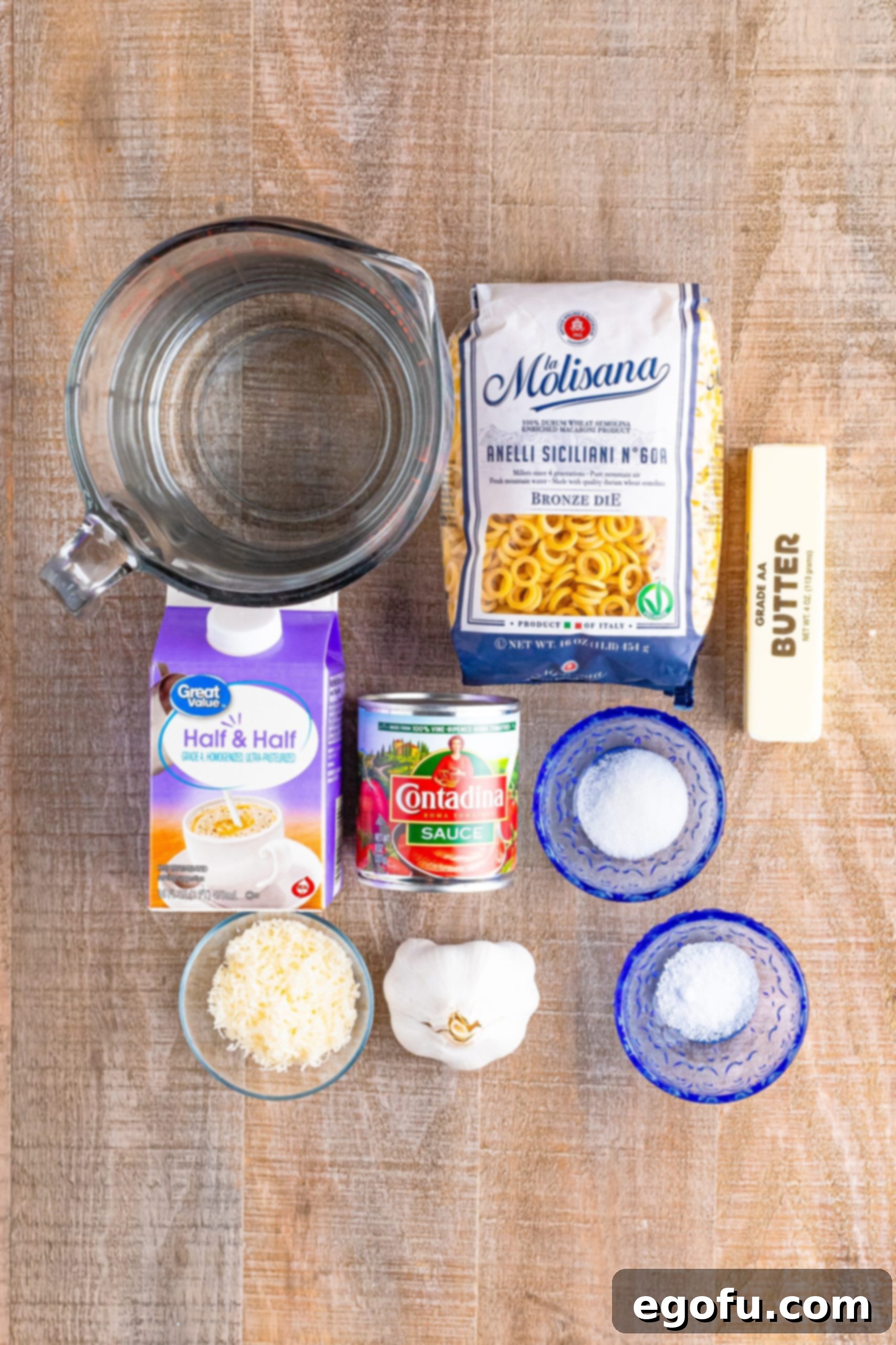 Wholesome Pasta O's 3 Salted butter, minced garlic, water, tomato sauce, half and half, granulated sugar, salt, anelli pasta, and fresh grated parmesan cheese.