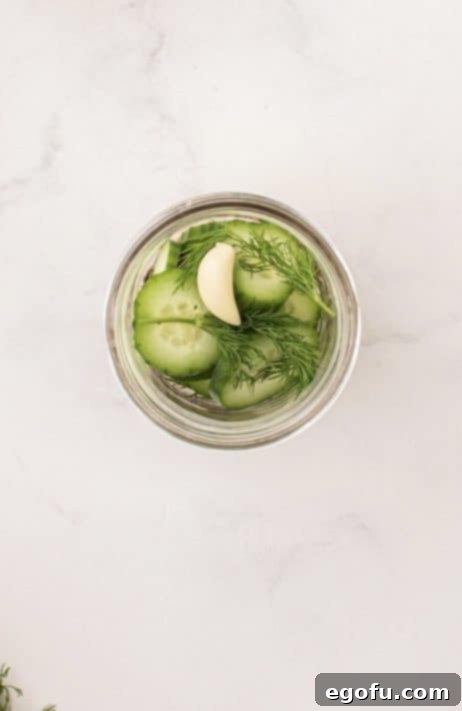 Clove of garlic added to mason jar.