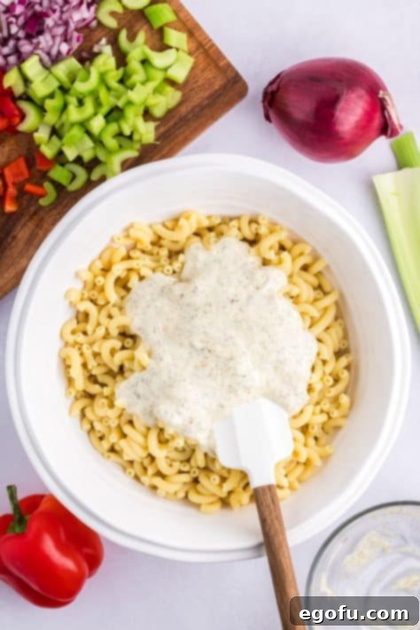 Homemade dressing on top of cooked pasta.