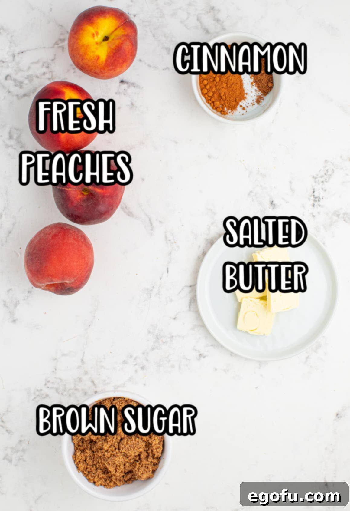 Close-up of the simple ingredients: fresh peaches, a stick of butter, a bowl of brown sugar, and a small dish of ground cinnamon.
