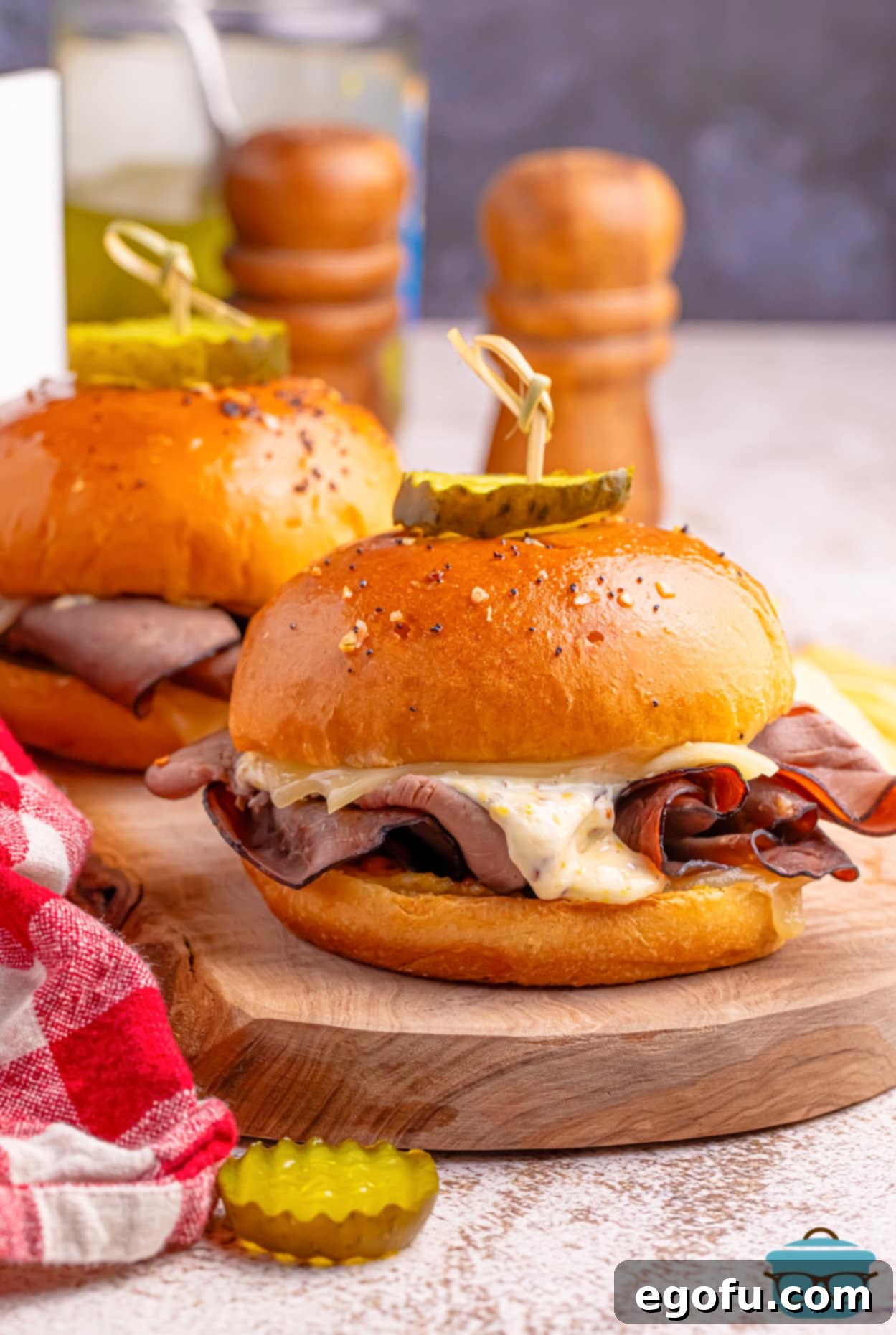 Ultimate Air Fryer Roast Beef Melts 6 A few Air Fryer Roast Beef Sandwiches arranged on a serving platter.