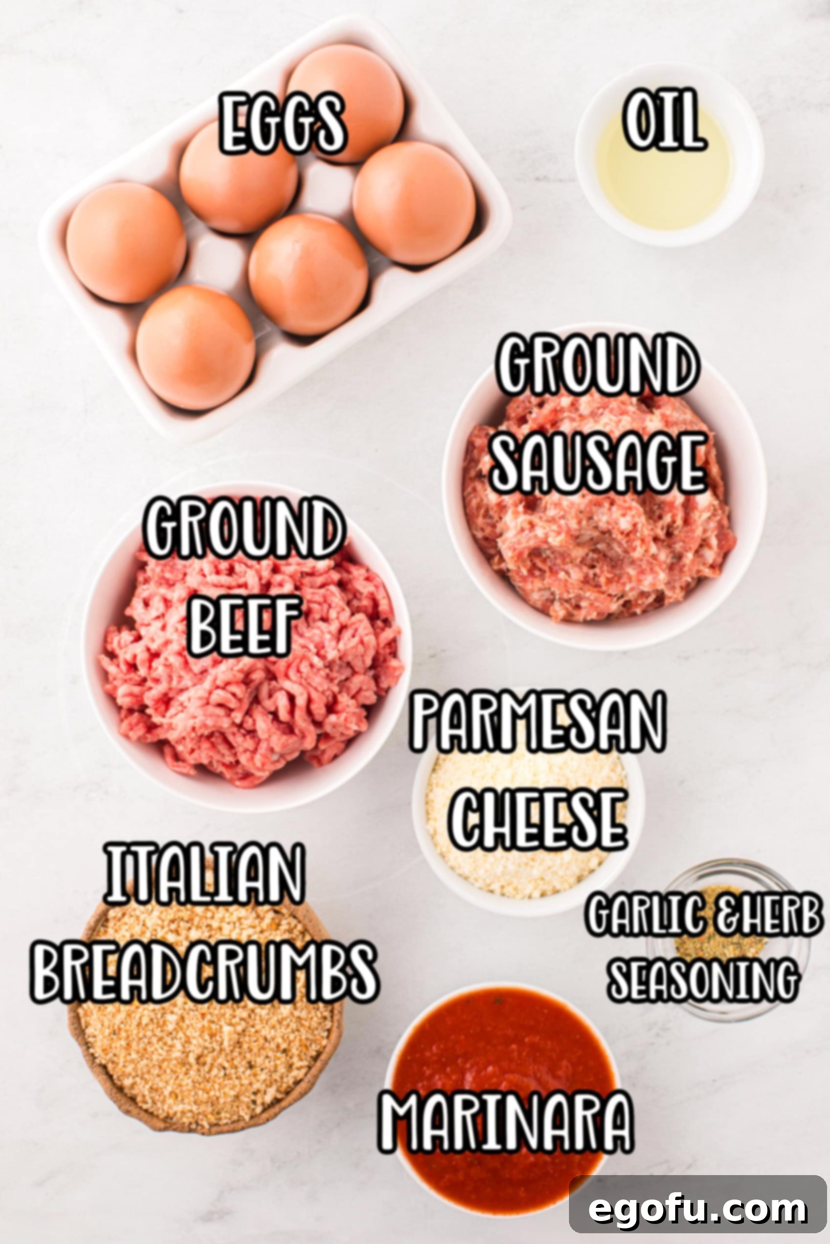A vibrant flat lay image showcasing all the fresh ingredients needed for Instant Pot Meatballs: eggs, lean ground beef, pork sausage, grated parmesan cheese, Italian bread crumbs, salt, garlic and herb seasoning, water, and a jar of rich marinara sauce.