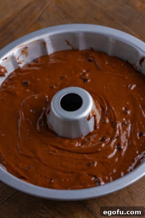 Velvet Chocolate Pudding Bundt 13 Cake batter in a bundt pan.