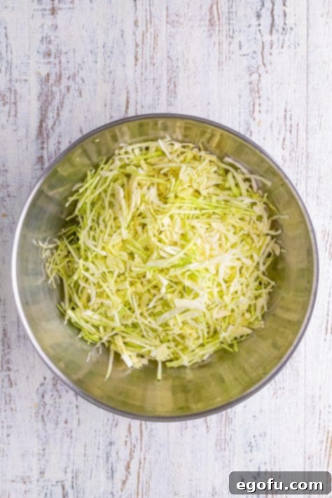 Fermented Goodness at Home 10 Shredded cabbage in a mixing bowl.
