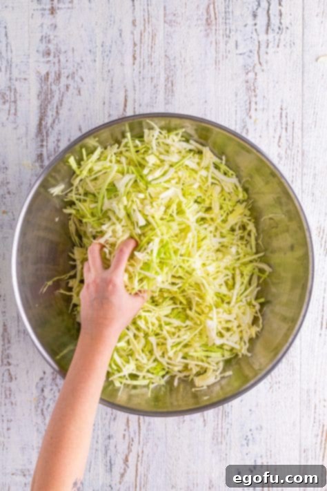 Fermented Goodness at Home 12 A hand massaging shredded cabbage.