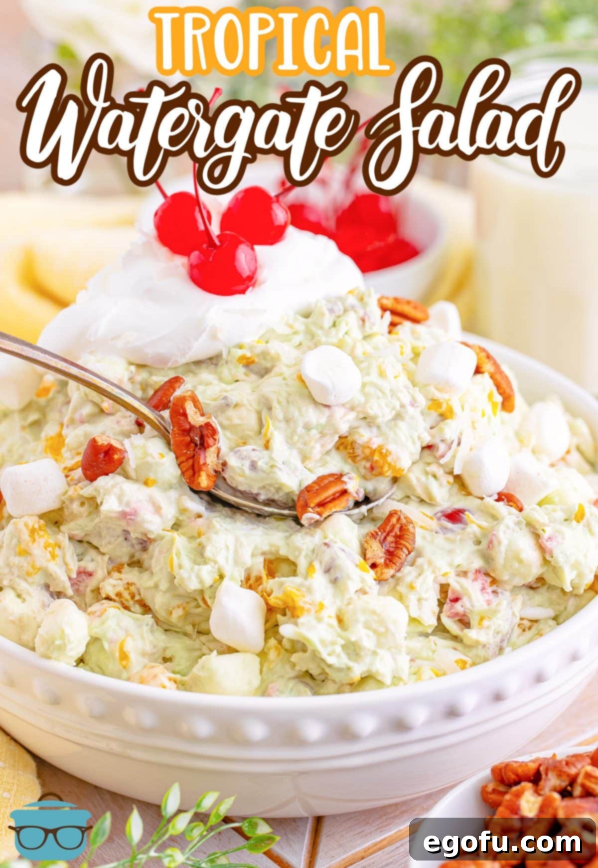 A spoon getting a heaping scoop of Tropical Watergate Salad.
