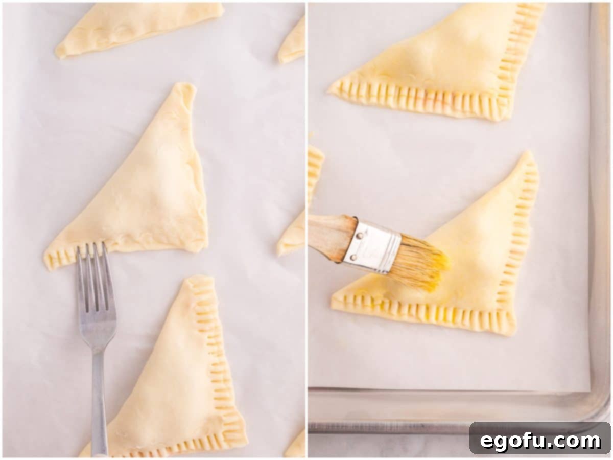 A two-part image depicting the sealing process of a cherry turnover with a fork and the application of an egg wash with a pastry brush.
