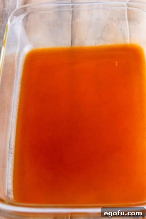 Cheesy Chicken Enchilada Fiesta 12 Enchilada sauce spread evenly across the bottom of a 9x13 inch baking dish.