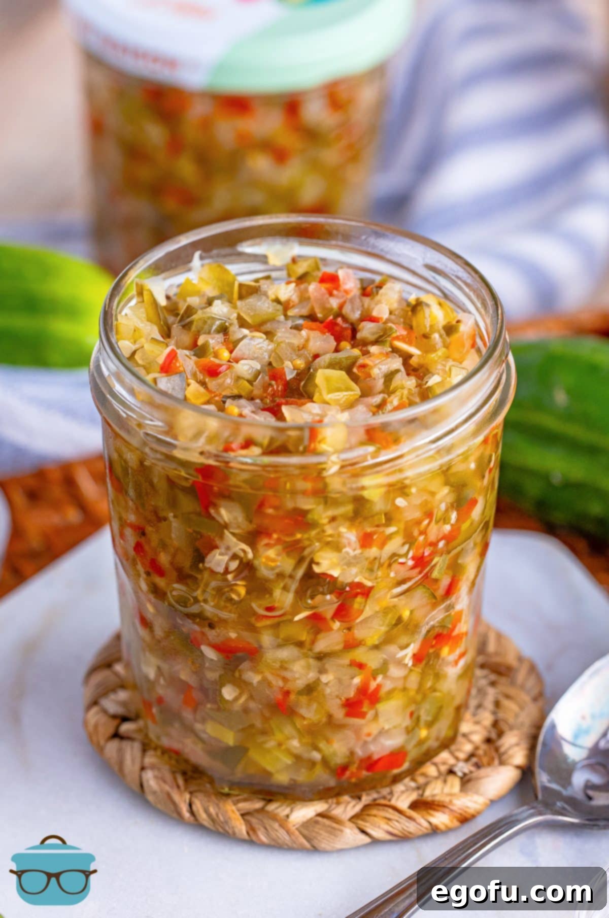 A jar of Homemade Sweet Pickle Relish on a plate. 