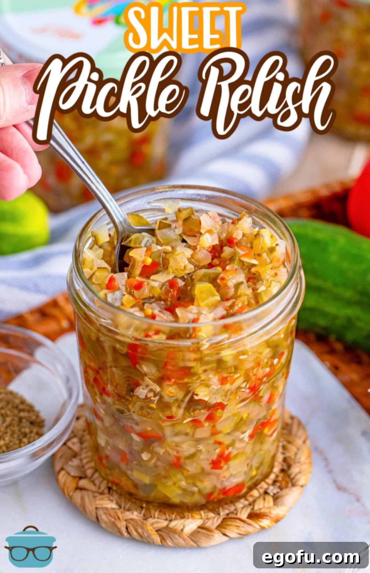 A spoon in a jar of Homemade Sweet Pickle Relish.