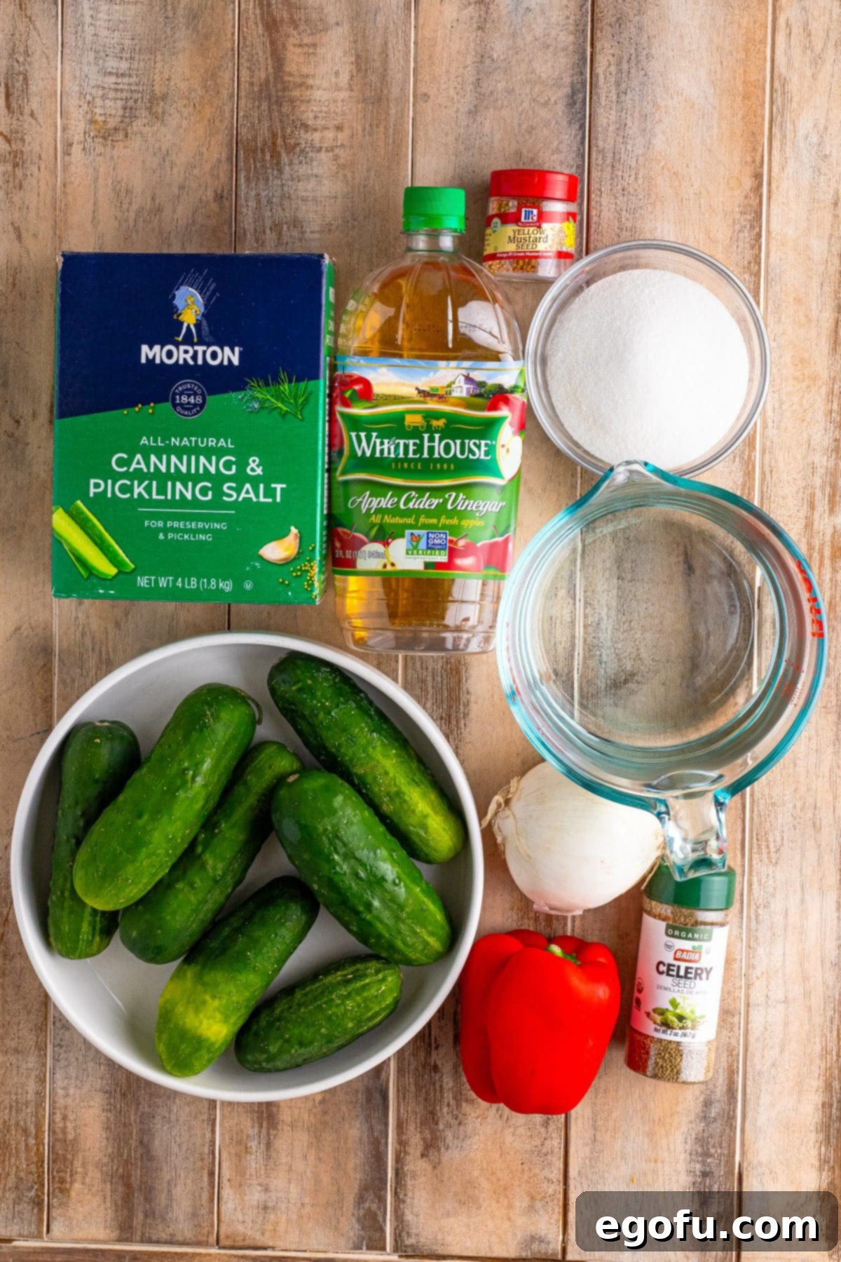 Cucumbers, pickling salt, apple cider vinegar, red bell pepper, onion, water, mustard seed, and celery salt.