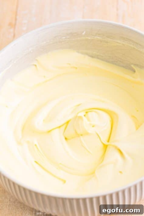 Vanilla pudding and Cool Whip frosting in a bowl.