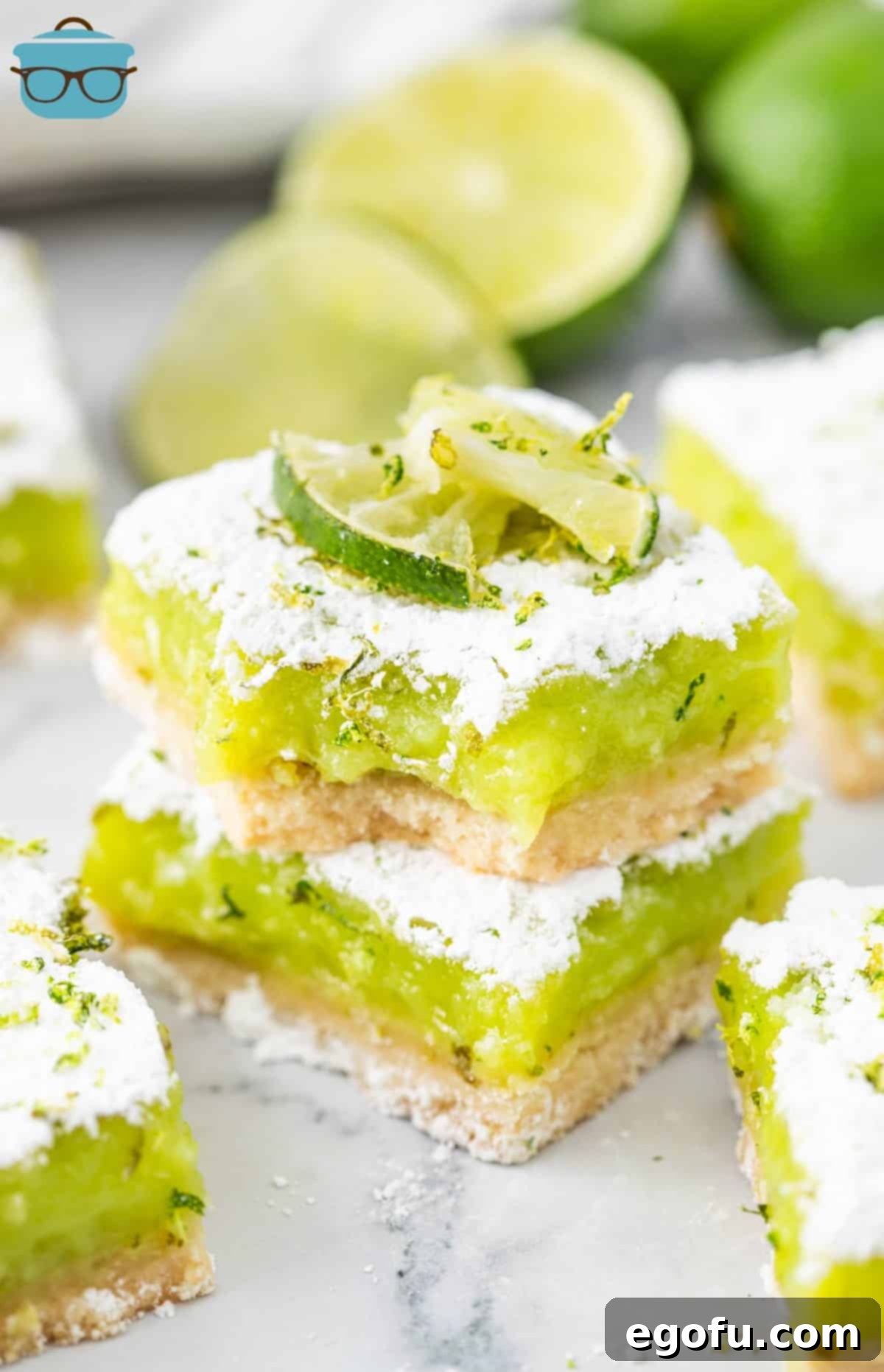 A close-up shot of a few delicious Lime Bars, stacked invitingly, with one bar showing a missing bite, highlighting its tempting texture.