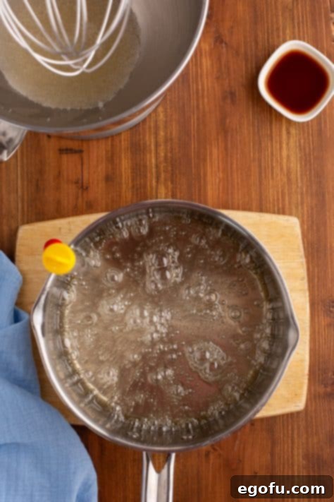 A saucepan with the sugar syrup mixture with a candy mixture.